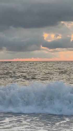 Batumi at sunset: Black Sea waves and a glowing classical facade