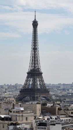 Eiffel Tower and busy Parisian boulevard from ground and air