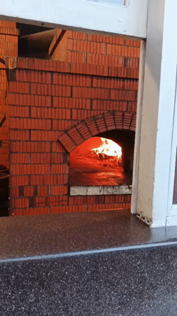 Wood-fired pizza and murals at a Berehove cafe