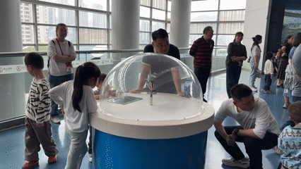 Families explore interactive exhibits at Chongqing Science Museum