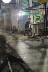 Nighttime motorcycle meetup outside a building in Sukomulyo