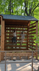 Park visitors enjoy climbing, scootering on sunny afternoon in Votkinsk