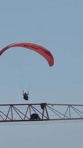 Tandem paragliders fill the skies above Boreti, Montenegro