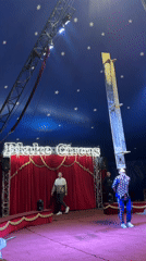Flake Circus performance features harlequin performer and robot in Riga
