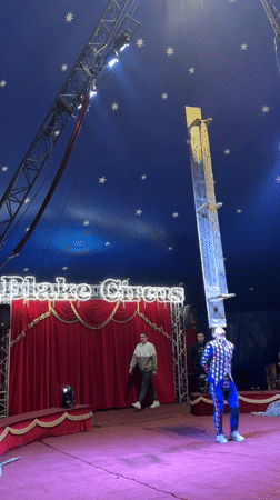 Flake Circus performance features harlequin performer and robot in Riga