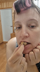 Woman in hair curlers eats baked good in South Korea