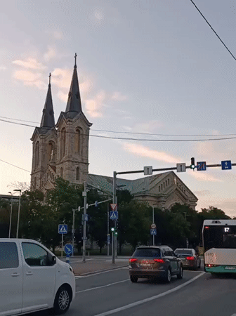 Twin-spired stone church anchors a Tallinn street scene