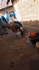 Morning outdoor laundry and dishwashing activities in Jos