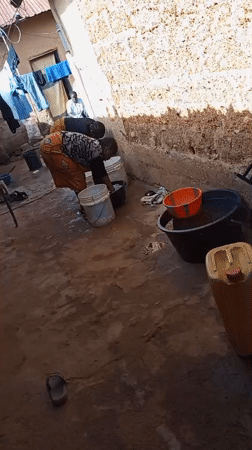 Morning outdoor laundry and dishwashing activities in Jos