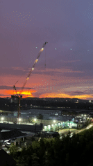 Purple-orange sunset observed over Pattaya City construction site