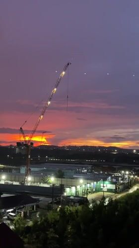 Purple-orange sunset observed over Pattaya City construction site