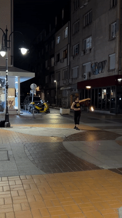 Fire-spinning performance lights up Sofia sidewalk at night