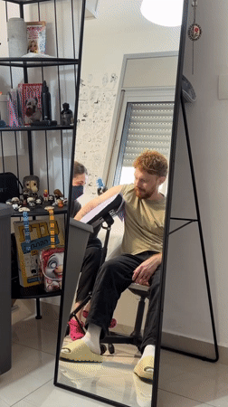 Tattoo session and bathroom selfie documented in Bat Yam