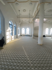 Prayer session documented at Kandahar mosque with traditional refreshments