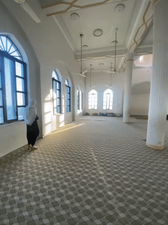 Prayer session documented at Kandahar mosque with traditional refreshments
