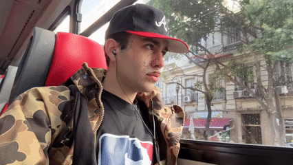 Tattooed passenger observed on Buenos Aires bus during evening commute
