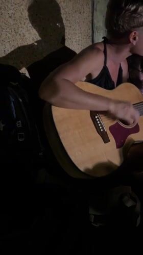 Street musician performs acoustic set in Nha Trang