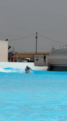 Surfers ride artificial waves at Tel Aviv wave pool