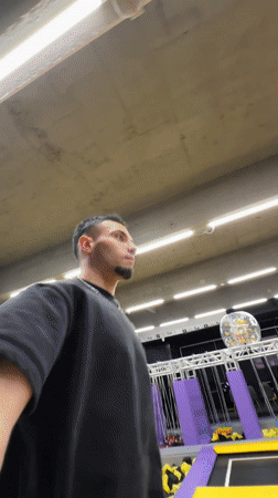 Man performs backflips at indoor trampoline park in Bulgaria