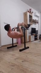 Man performs indoor calisthenics workout in Burgas apartment