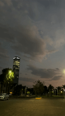 Evening view of illuminated BBVA skyscraper in Mexican suburb