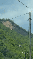 Vehicle records hillside with rocky patch in Bodorna, Georgia