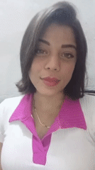Woman smiles, brushes hair in Tinaquillo, Venezuela