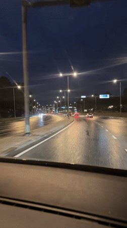 Evening street life documented in rainy Tallinn