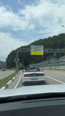 Open-top driving through Estosadok's mountain highway corridor