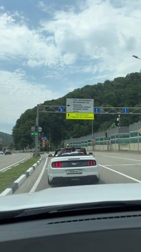 Open-top driving through Estosadok's mountain highway corridor