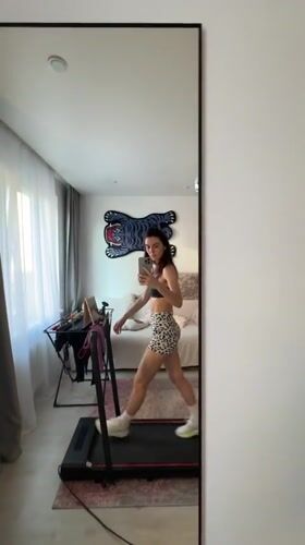Woman documents treadmill workout session in Tyumen apartment