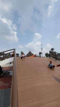 Families enjoy early morning playground time in Sidoarjo park