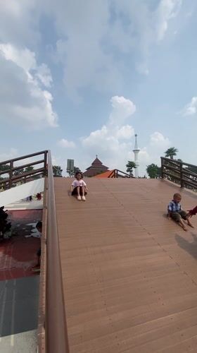 Families enjoy early morning playground time in Sidoarjo park