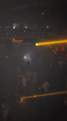 Female DJ performs at crowded Barcelona nightclub venue