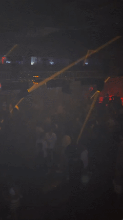 Female DJ performs at crowded Barcelona nightclub venue