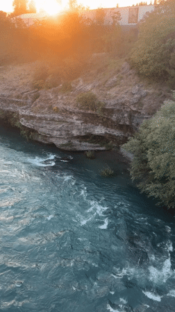 Sunset river flows rapidly through Podgorica Montenegro