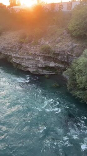 Sunset river flows rapidly through Podgorica Montenegro