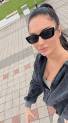 Woman takes casual selfie on pathway in Novorossiysk