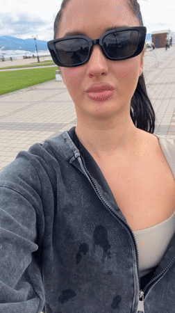 Woman takes casual selfie on pathway in Novorossiysk