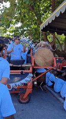 Traditional Balinese funeral procession observed in Denpasar streets
