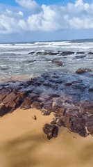 Rocky shoreline and resort scenes along Phú Quốc's coast