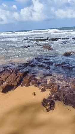 Rocky shoreline and resort scenes along Phú Quốc's coast