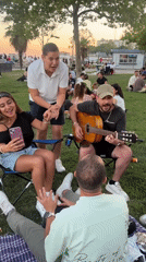 Friends unwinding at a Kadıköy park during golden hour