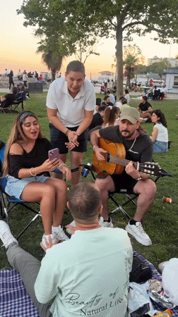 Friends unwinding at a Kadıköy park during golden hour