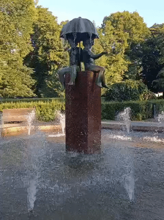 Tallinn park fountain and bakery display, summer morning
