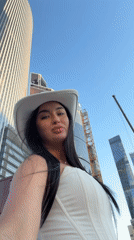 Woman Takes Selfie Against Khimki Skyline on Clear Day