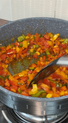 Bell peppers cooked in frying pan in Igboefon