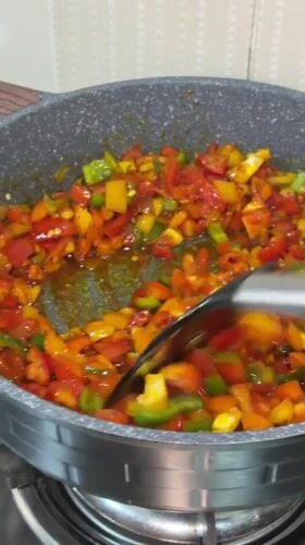 Bell peppers cooked in frying pan in Igboefon