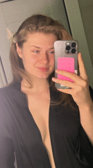 Woman takes mirror selfie in Kazan apartment