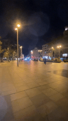 Nighttime plaza scene captured in Barcelona